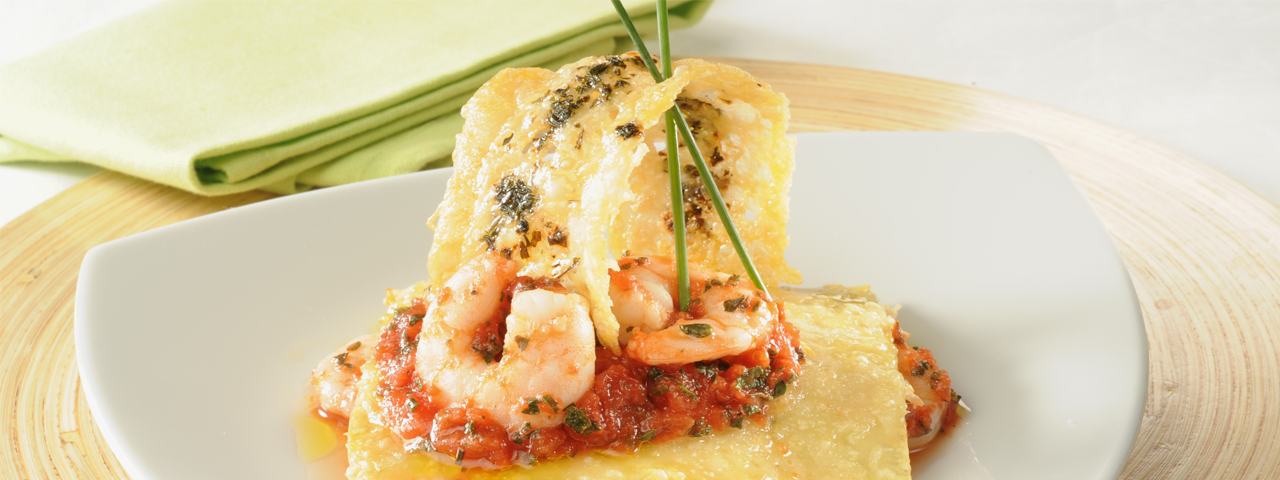 Shrimps Lasagna with tomatoes and olives